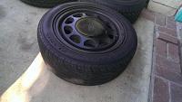 (4) four lug wheels painted black with tires-205-60-15-tires-75-percent-worn.jpg